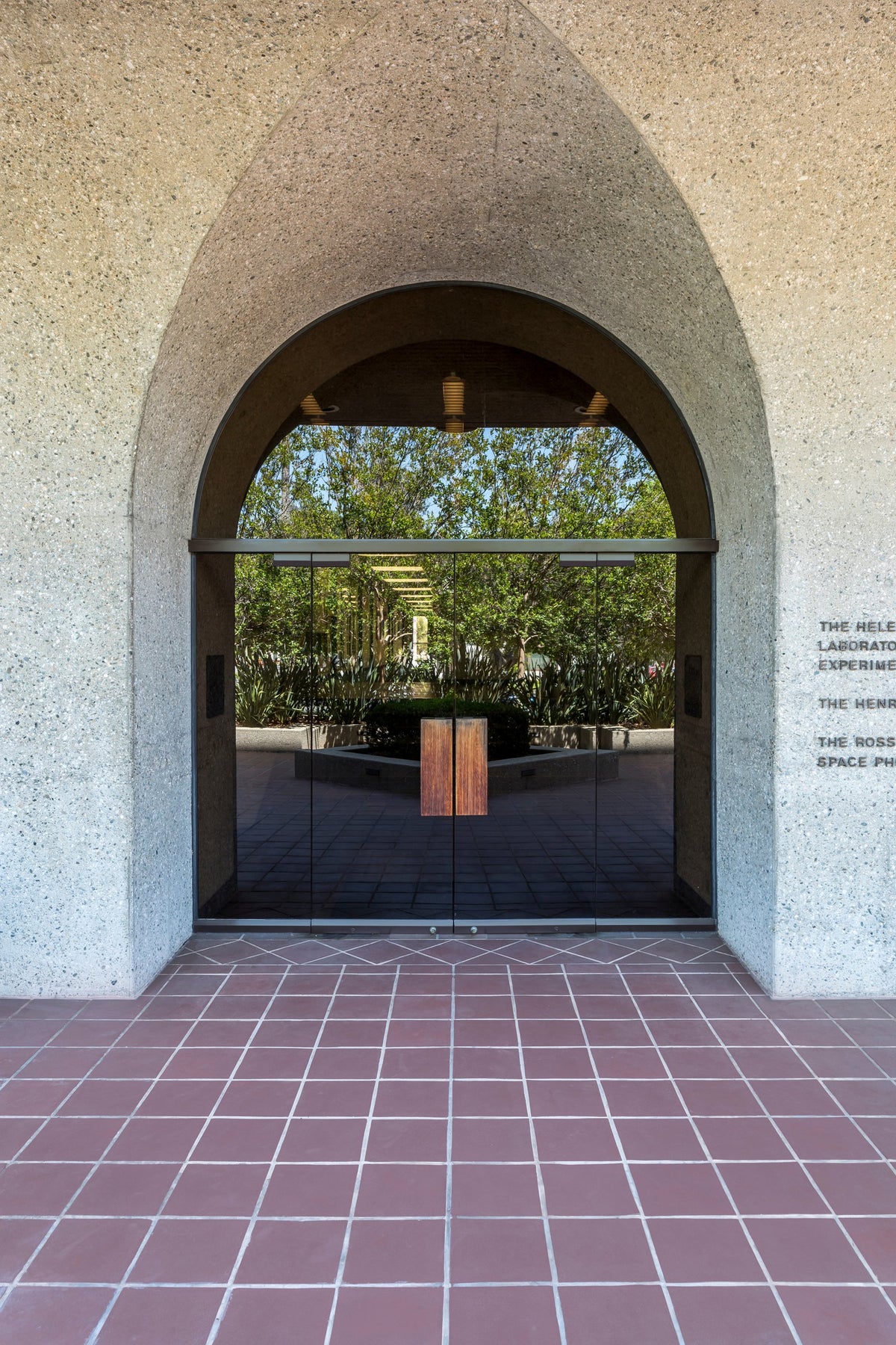 Arched entry over Monrovia ceramic paving