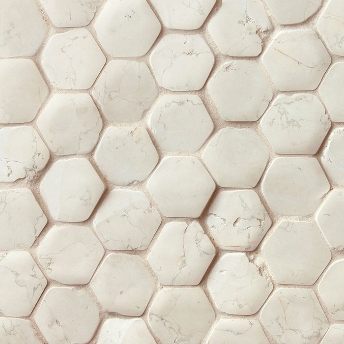 A sheet of hexagon marble mosaic in Bianco Antico, cream and parchment pieces with veins of green, taupe and brown
