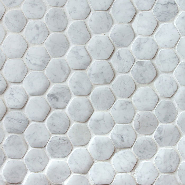 A sheet of hexagon marble mosaic in Carrara, white and light grey pieces with soft grey veining