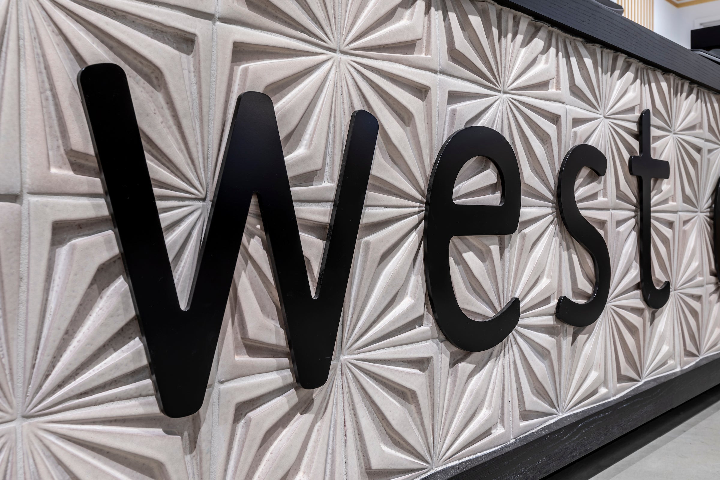 Ceramic 3D Impressions Compass Star panels covering a retail wall