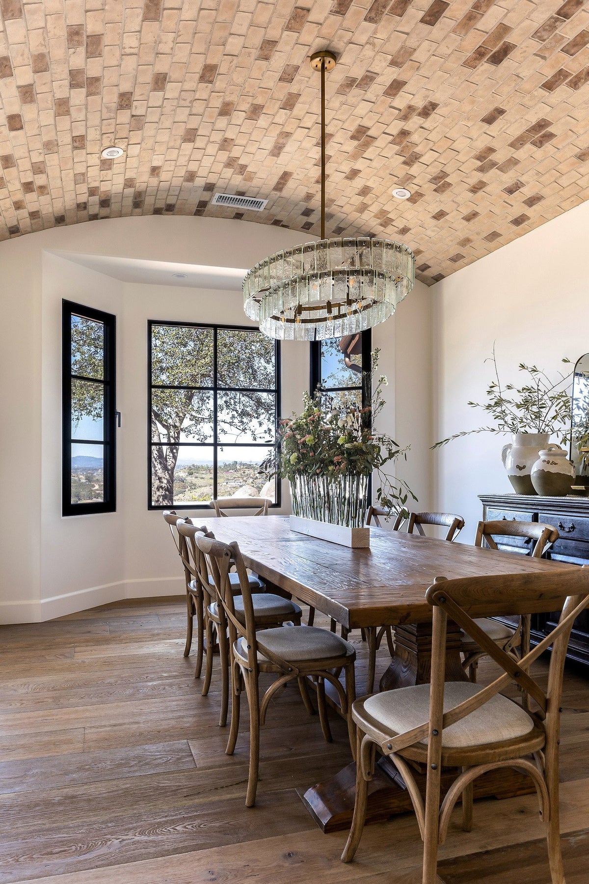 Dining table below the brick ceiling