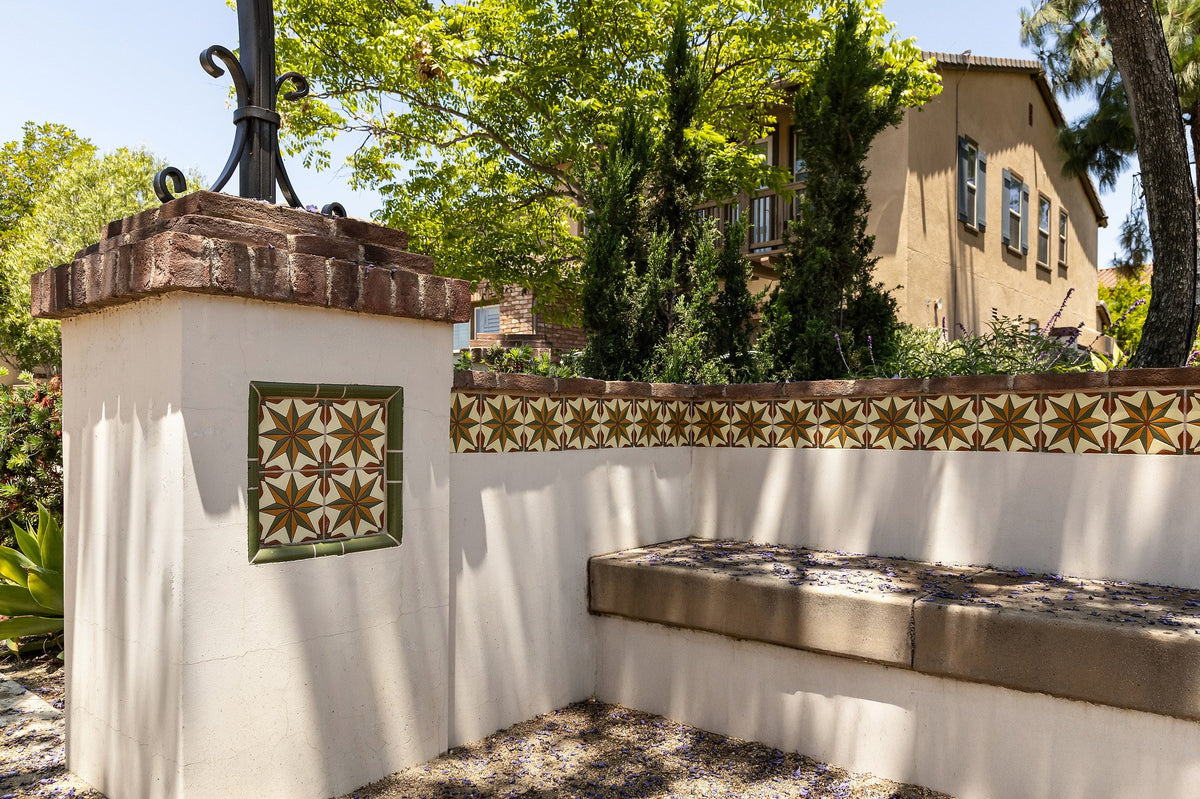 Garden bench with handpainted tile band