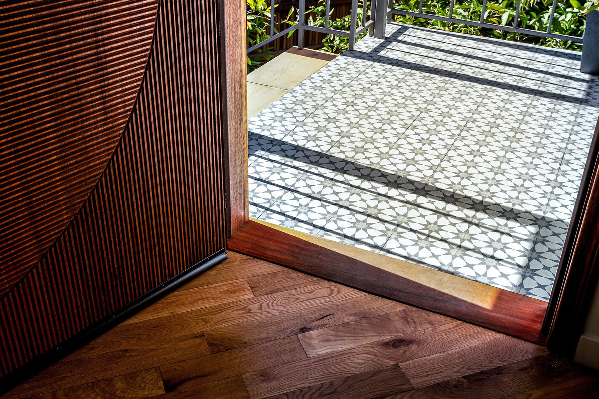 Front door opening to tiled landing
