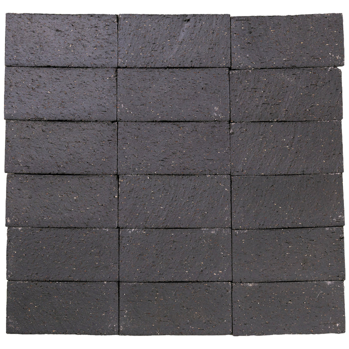 Several Catalina brick pavers in Charcoal laid up together, showing the range within the color