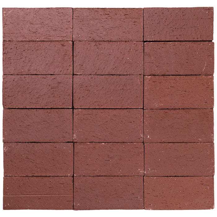 Several Catalina brick pavers in Burgundy laid up together, showing the range within the color