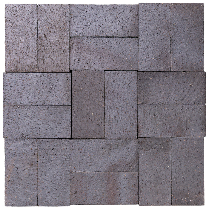 Several Catalina brick pavers in Dark Ironspot laid up together, showing the range within the color