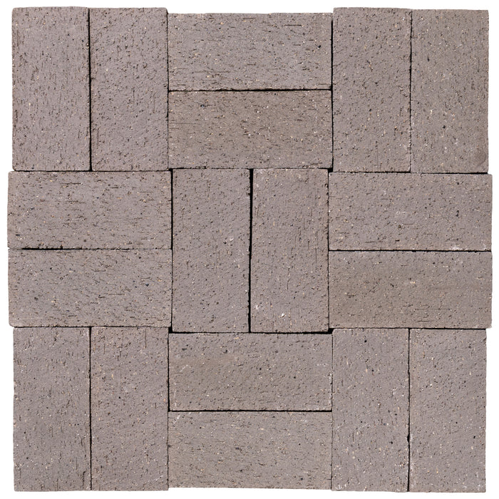 Several Catalina brick pavers in Sterling Grey laid up together, showing the range within the color