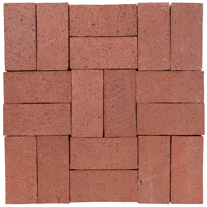 Several Catalina brick pavers in Sunset Red laid up together, showing the range within the color