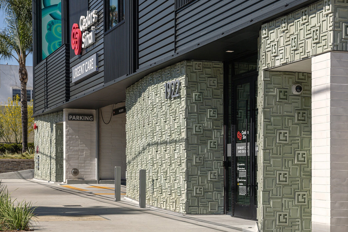 Cladding wraps the corner entry