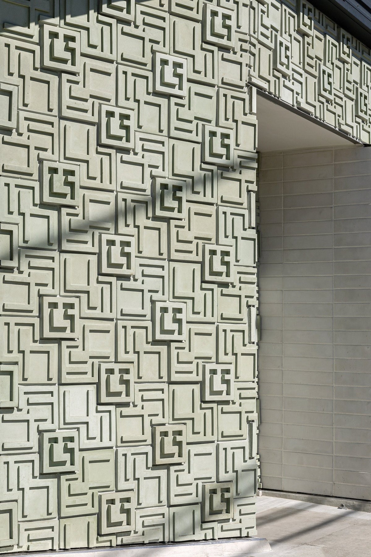 Relief panels beside a smooth wall