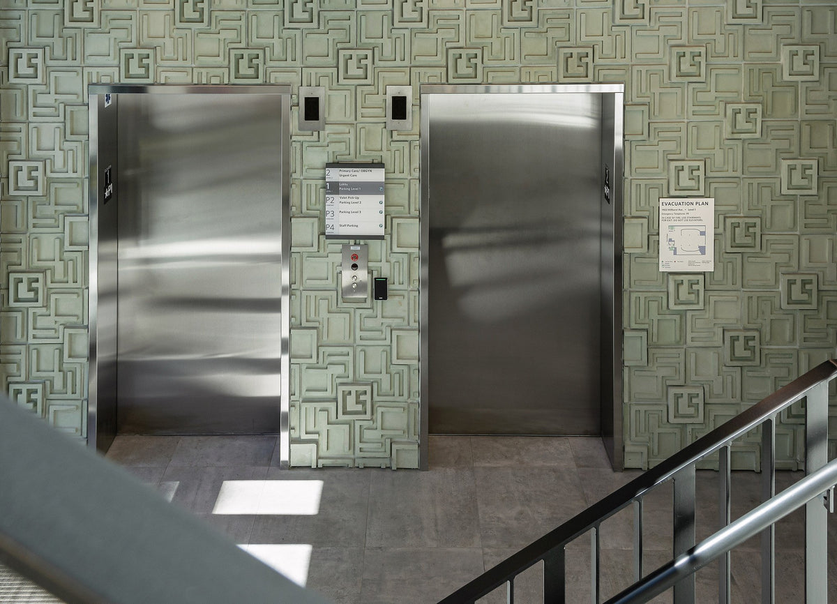 Elevator lobby clad in 3D concrete