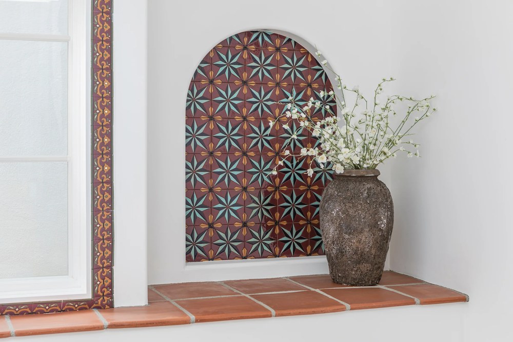 Handpainted decos set as a star panel in a window alcove, with a deco border and a terracotta sill, Santa Monica