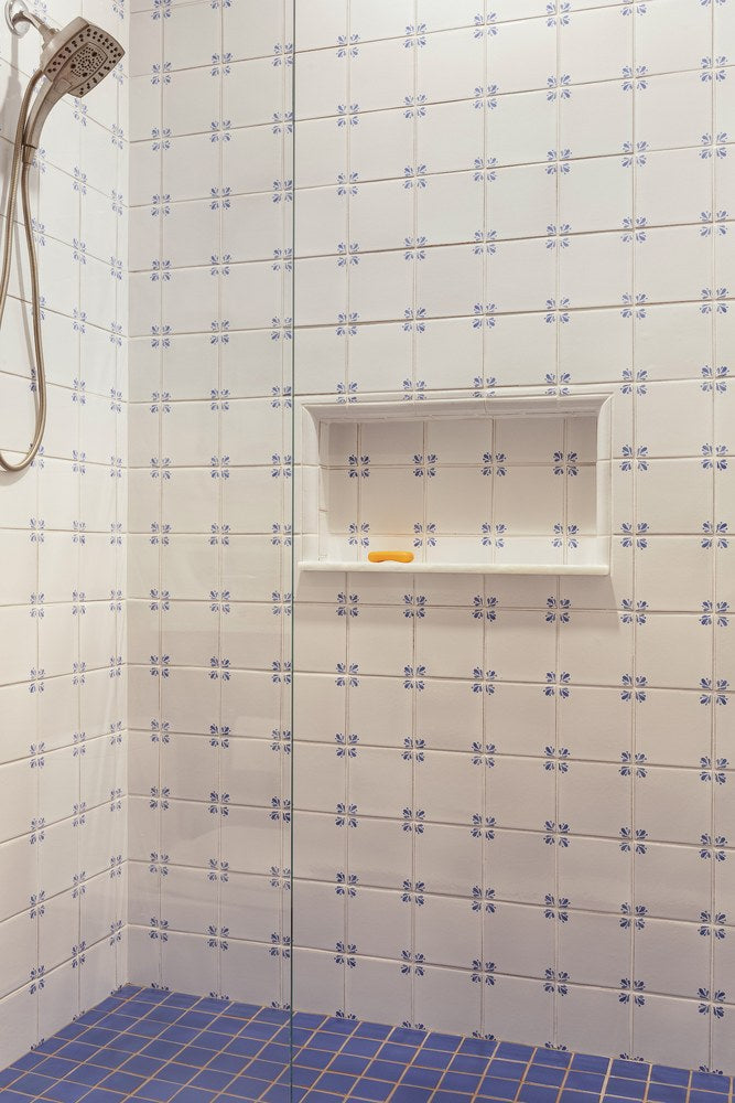 Peninsula decos set through a white field in a shower, over a Blue Satin floor, at a Delft bath in Kingsburg