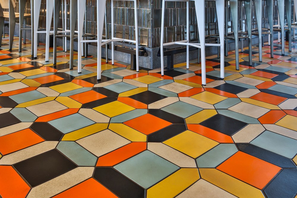 The Studio Picket Set on a restaurant floor, in a repeating geometric pattern