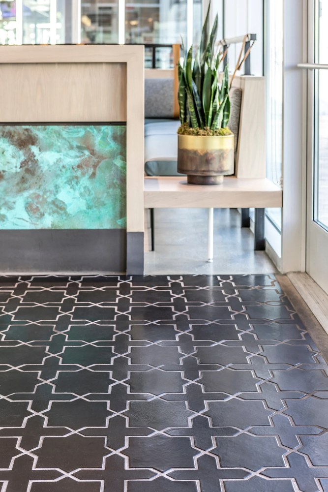 Studio Arabesque 2C on a floor in the Black Diamond glaze