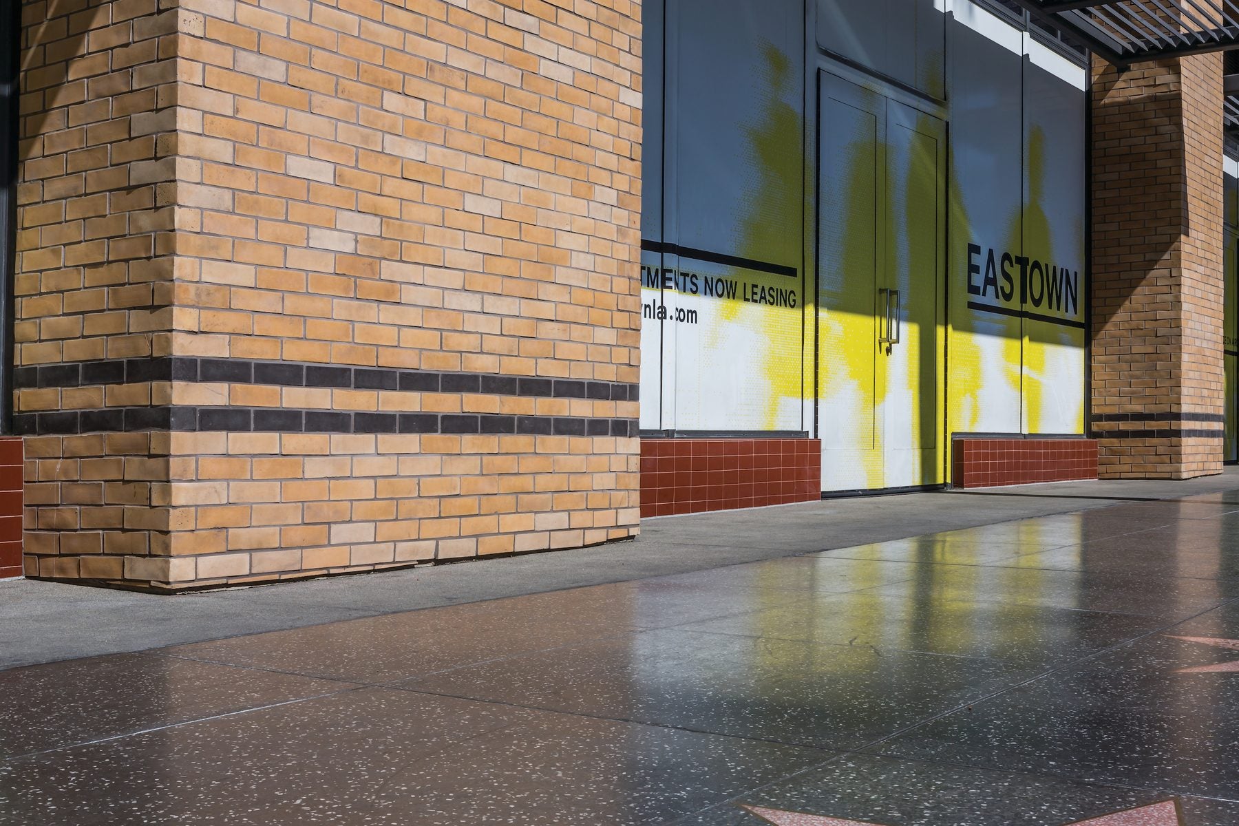 Artillo Brick Veneer in Old California at Eastown Apartments, with a dark banding course