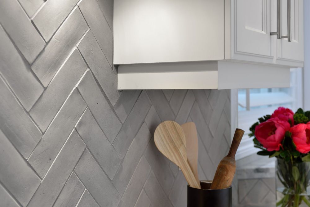 Artillo Brick Veneer in 2 by 8 Early Gray, herringbone kitchen backsplash