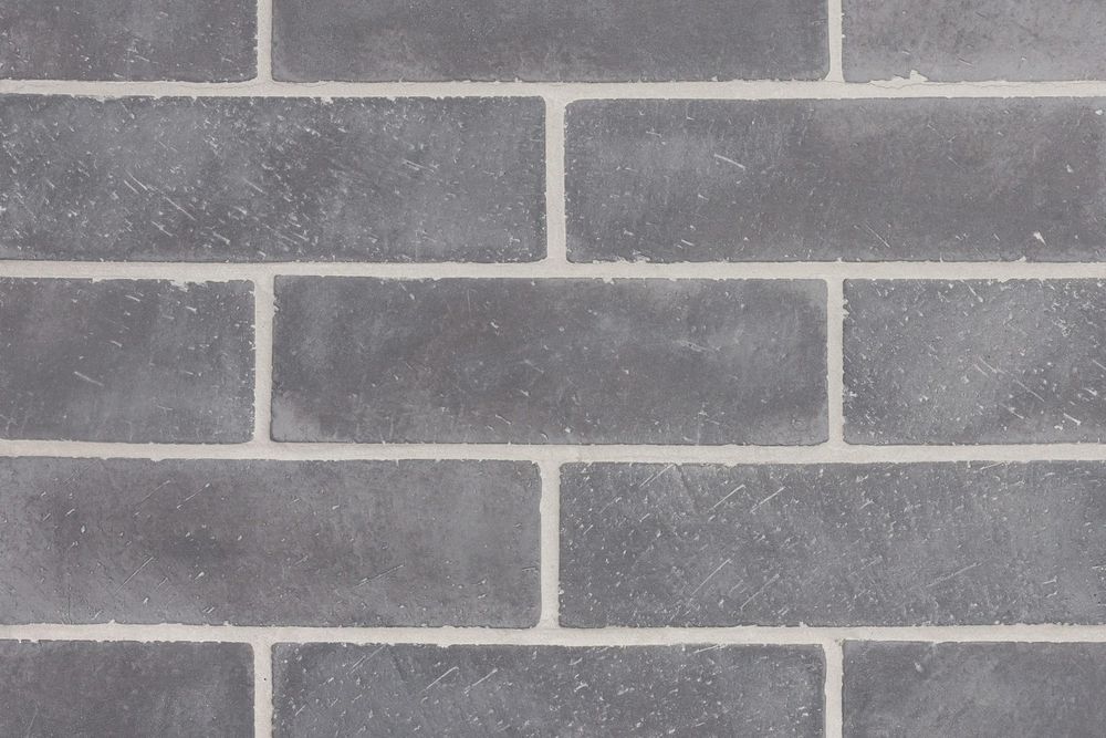 Norman Brick in 3 by 11 Charcoal, running bond field