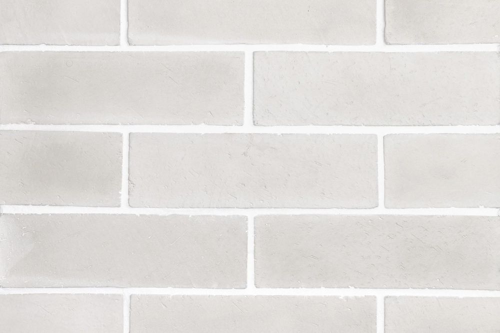 Norman Brick in 3 by 11 Rice, running bond field with white grout
