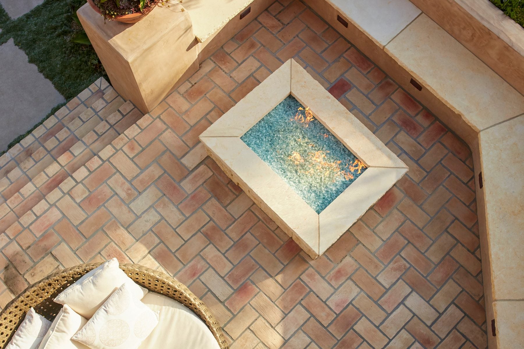 Bastogne Brick Veneer laid herringbone on a Pismo Beach patio, around a fire pit
