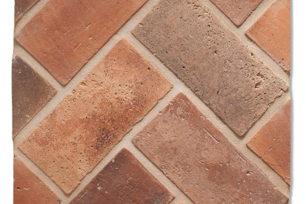 Swept Brick in 4 by 8 Normandy Cream, herringbone field showing the light brushed face and color range