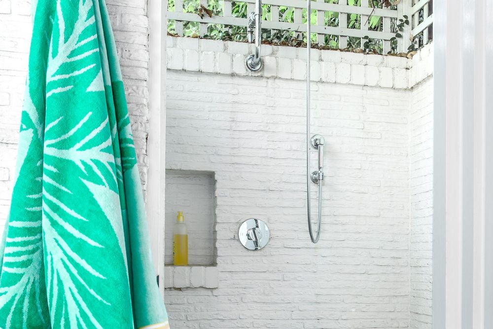 Villagio Brick painted white in an outdoor shower in Encino
