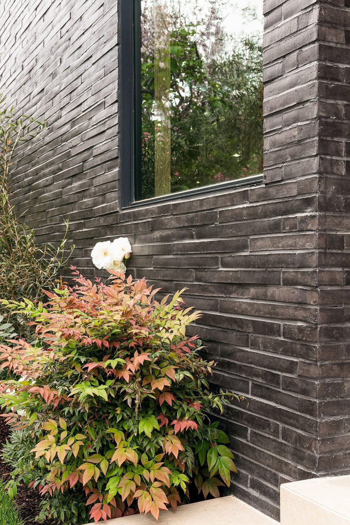Long brick courses beside a window