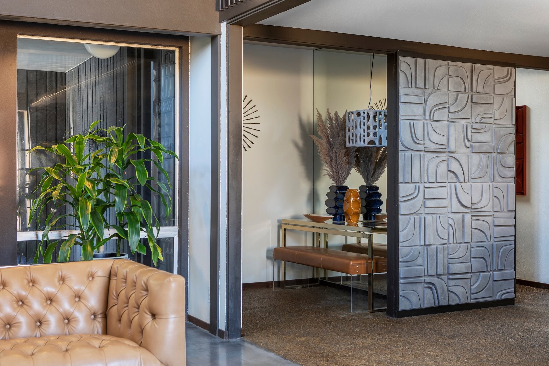 An M3LD Brute relief wall used as a room divider beside an entry console