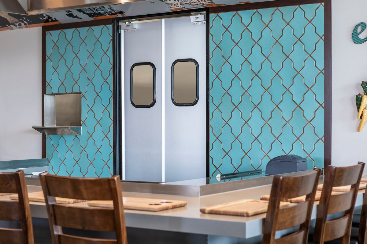 Kitchen doors flanked by Arabesque