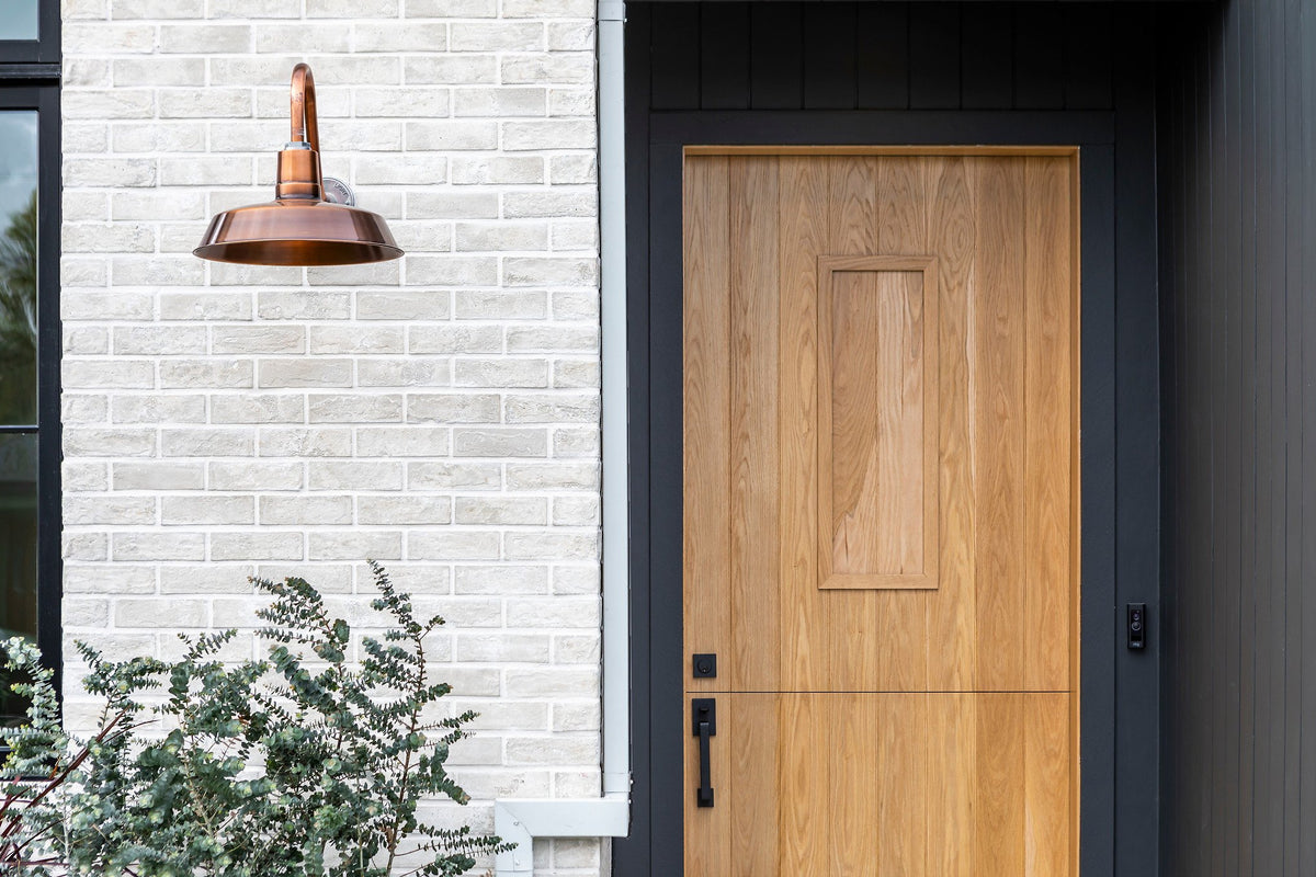 Brick beside the wood front door
