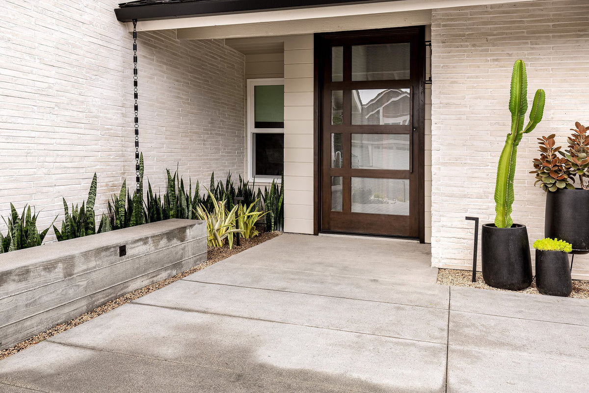 Planter along the brick entry wall