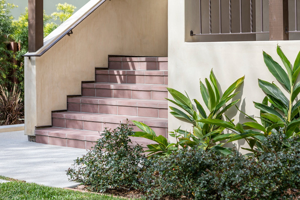 Tiled exterior stairs along the house