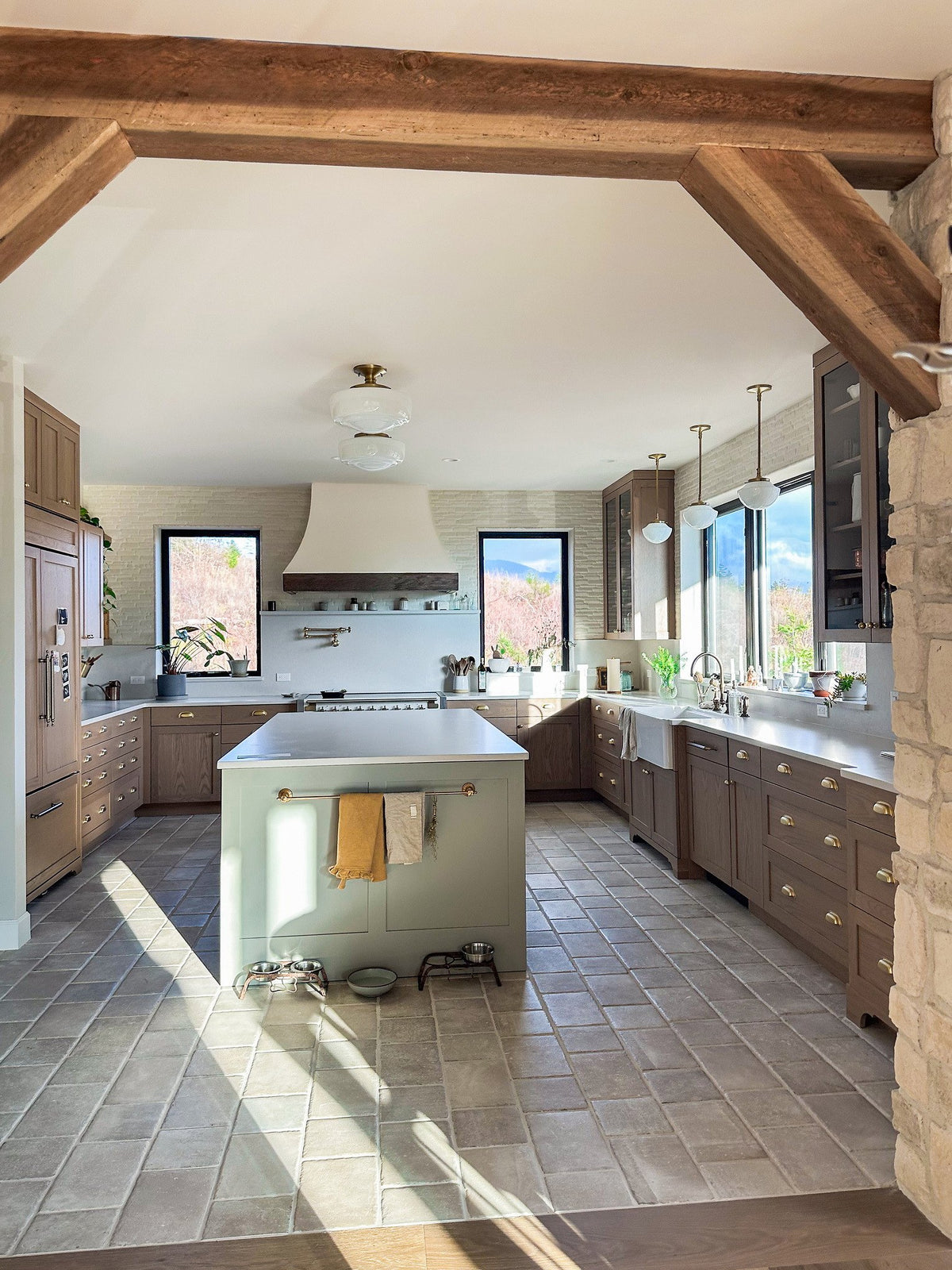 Sunlit kitchen under timber beams