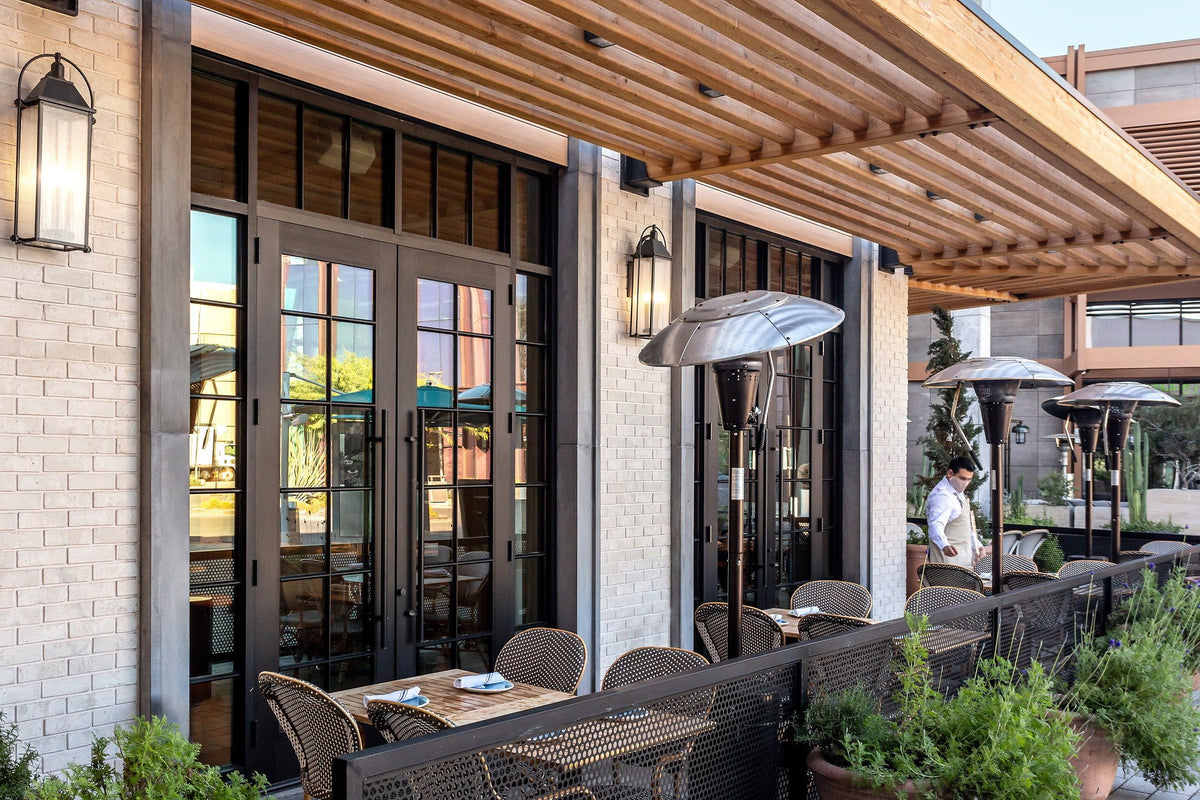 Patio dining along the brick wall