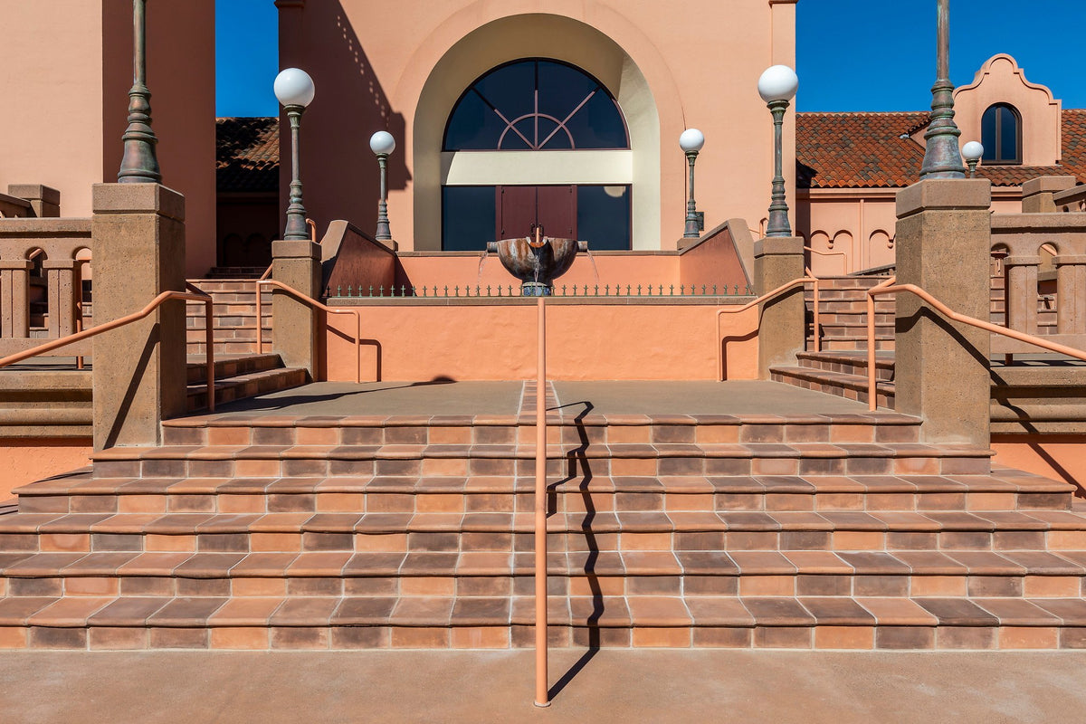 Wide steps leading to arched doors