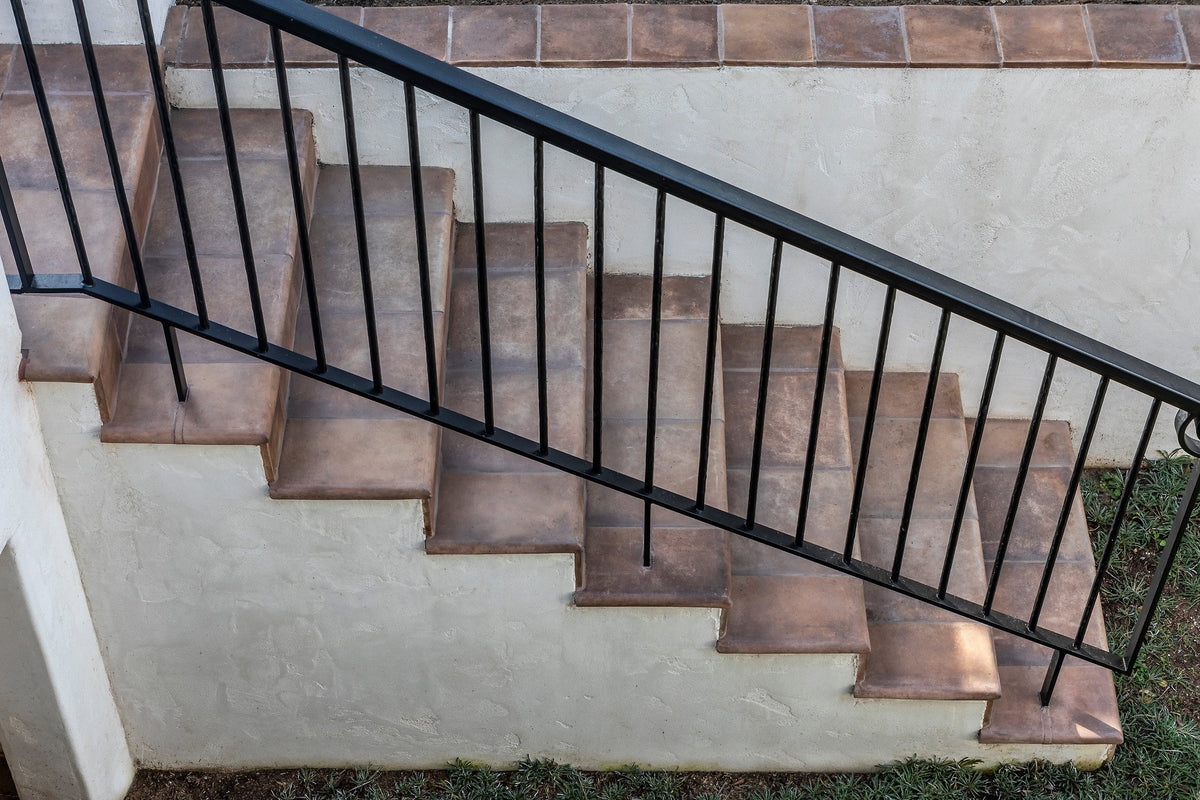 Stair treads along the stucco wall