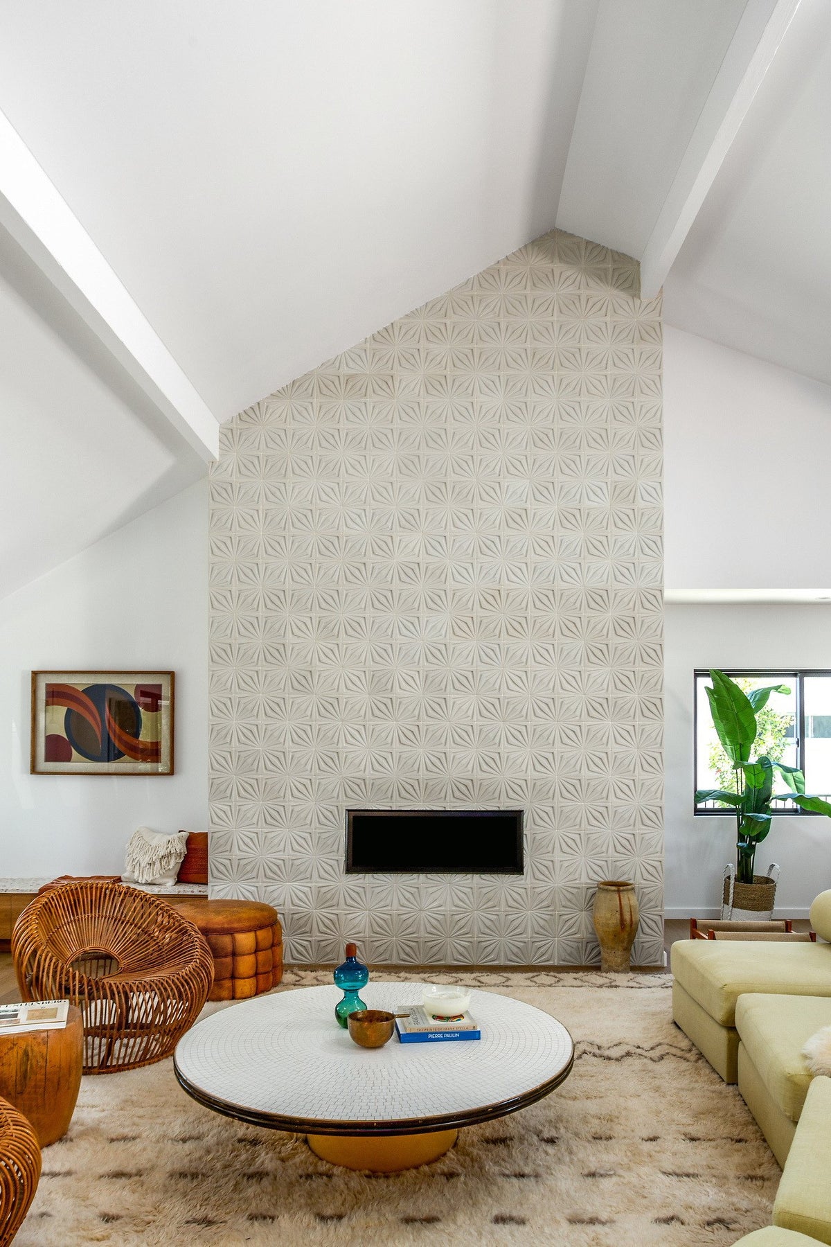 Full-height fireplace under vaulted ceiling