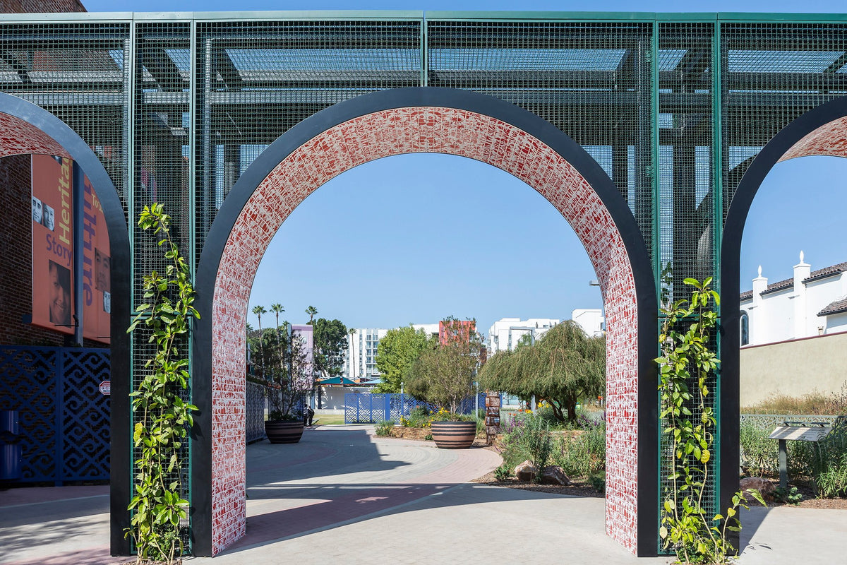 Handpainted tile arch framing the garden