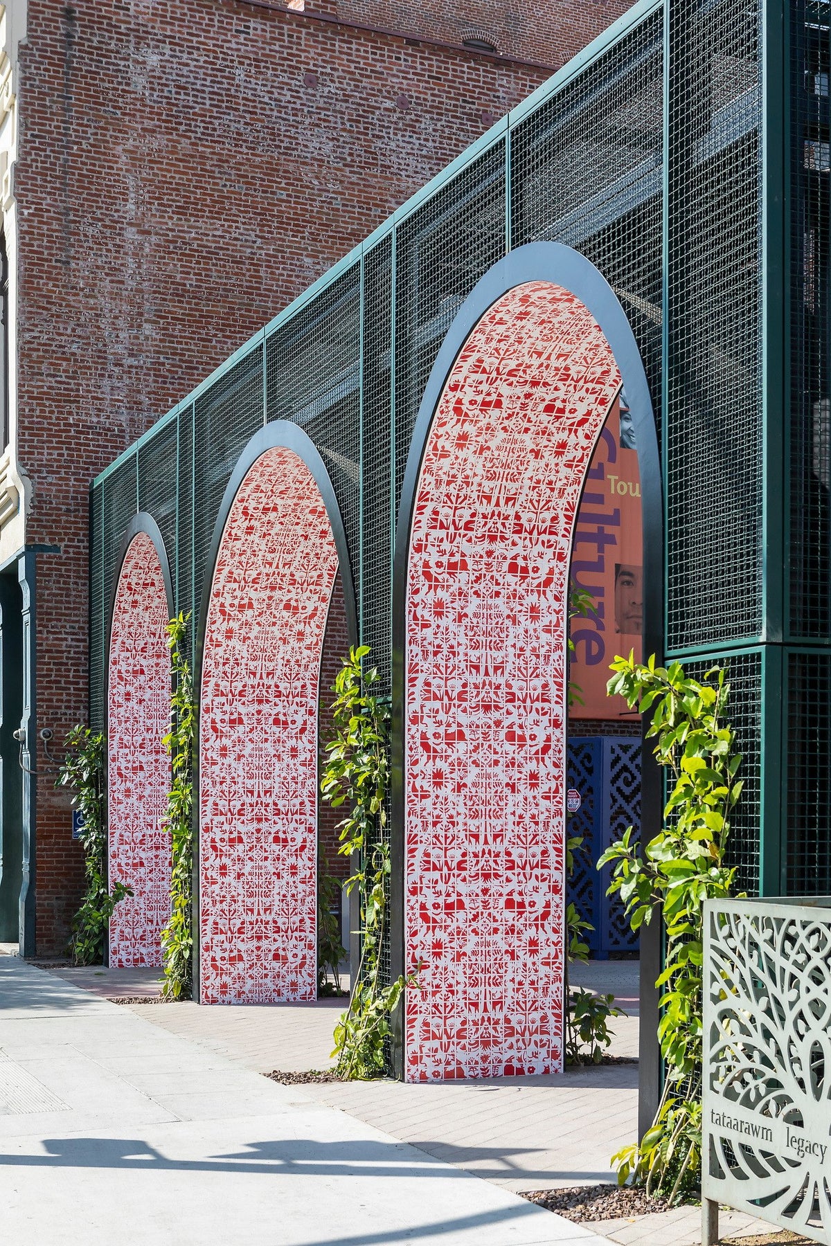 Tiled arches beside the brick building