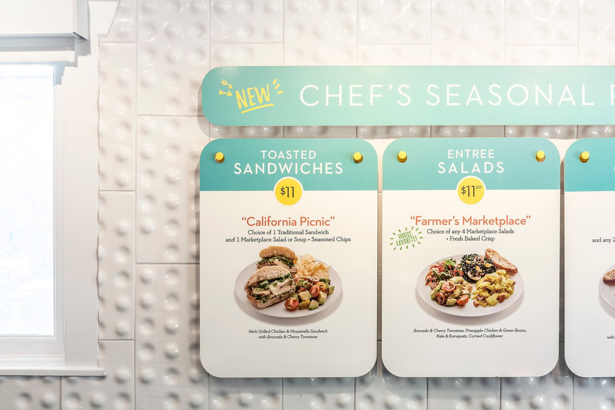 Menu boards on textured tile wall