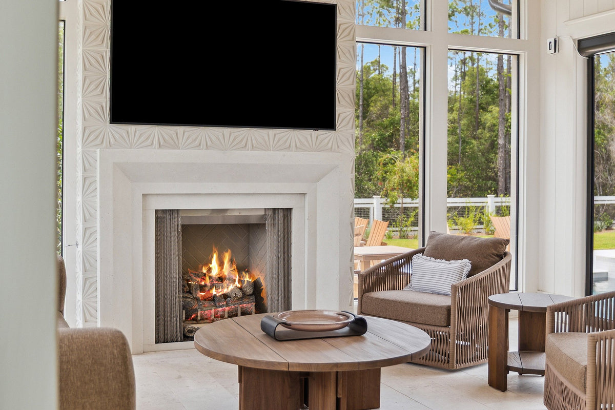 Sunroom fireplace with carved relief tile