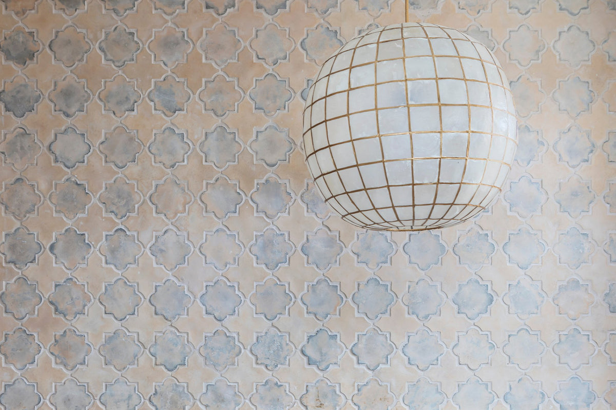 Arabesque wall beneath a capiz pendant