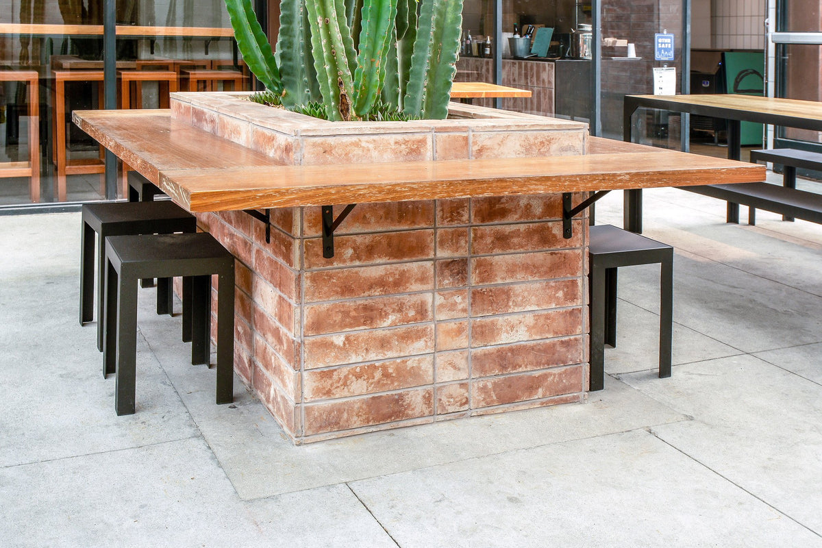 Patio communal table on tile base
