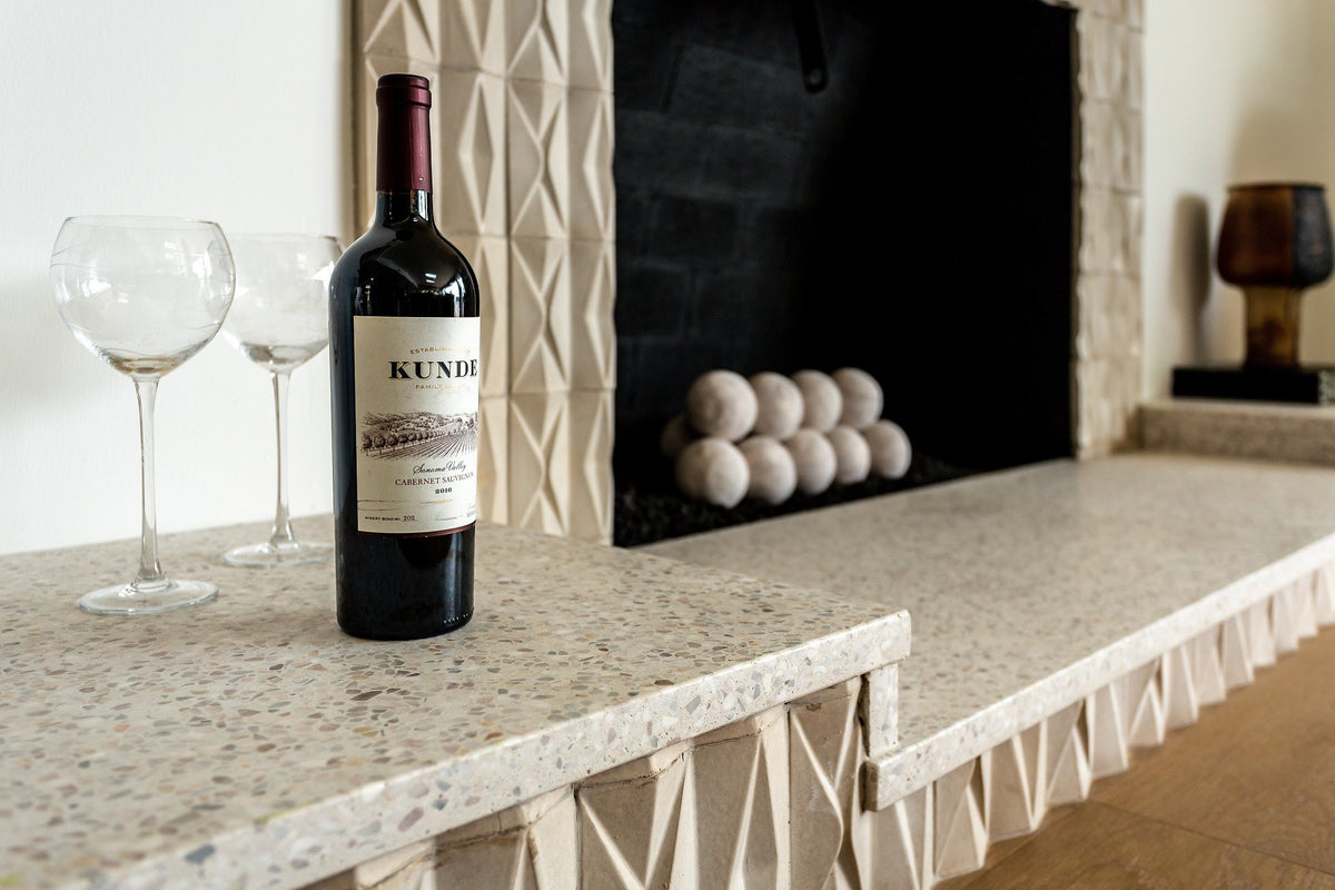 Terrazzo hearth on Compton tile