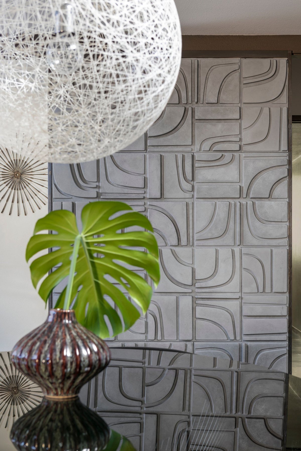 Feature wall behind a tropical leaf