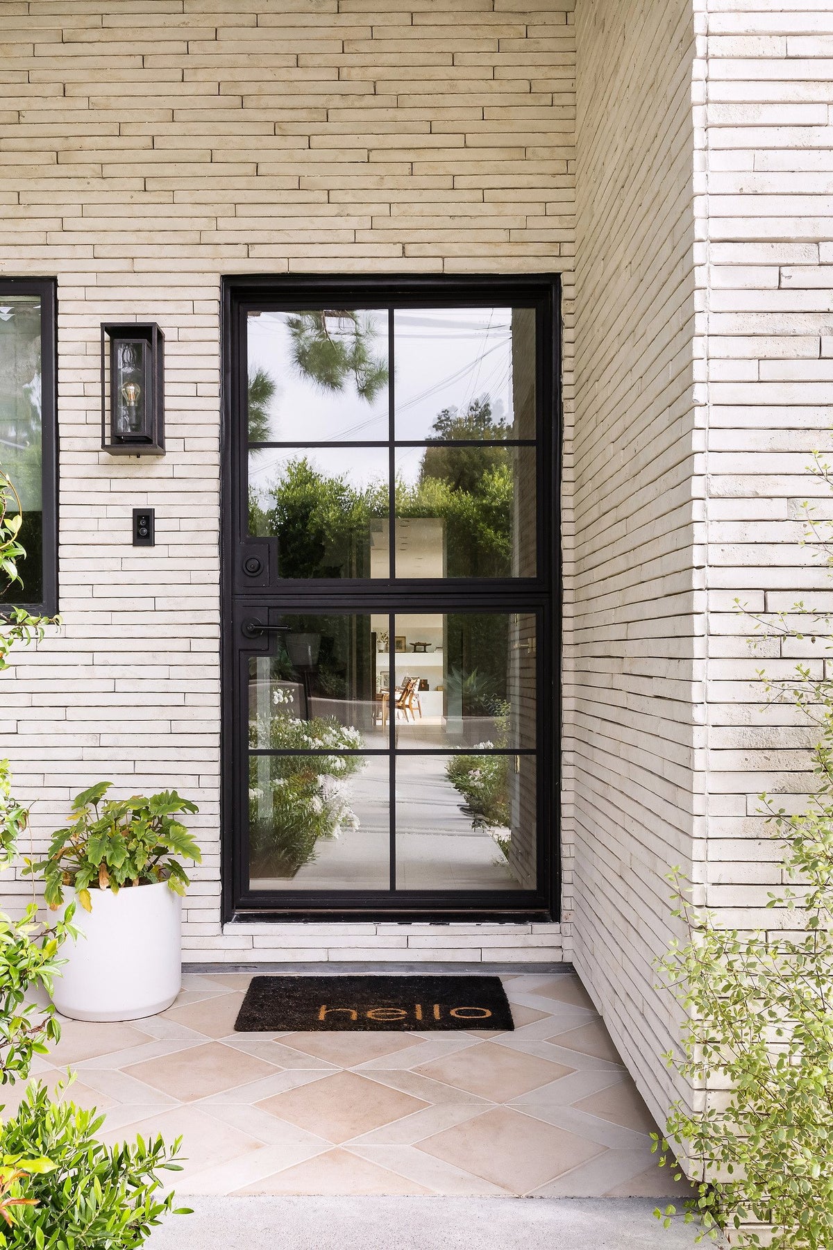 Front door framed by Newport Brick