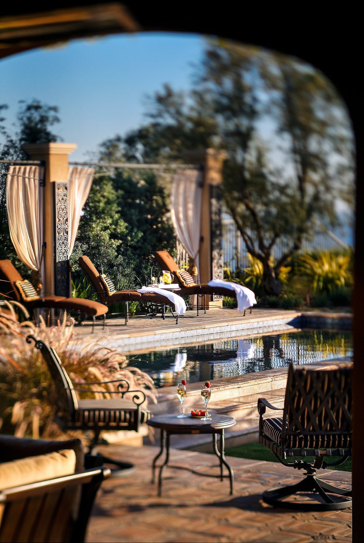Pool deck framed by an arch