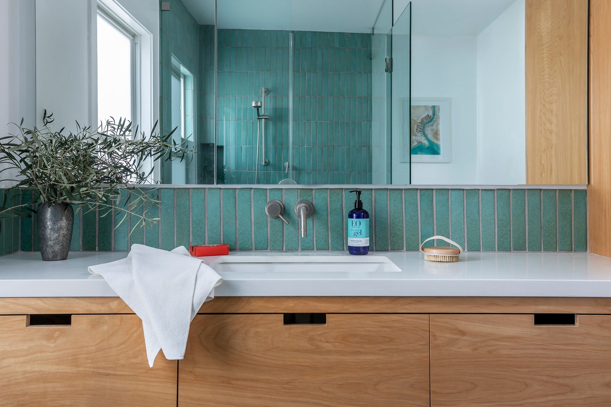 Aqua stacked tile above the vanity