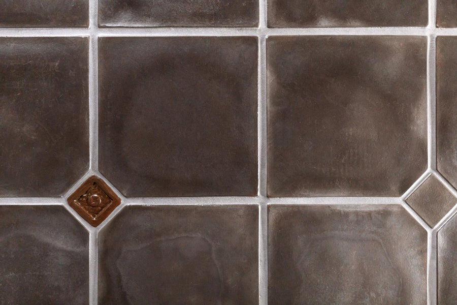 A bathroom in a Pasadena Spanish revival house floored in ARTO Artillo 12x12 in Smoke