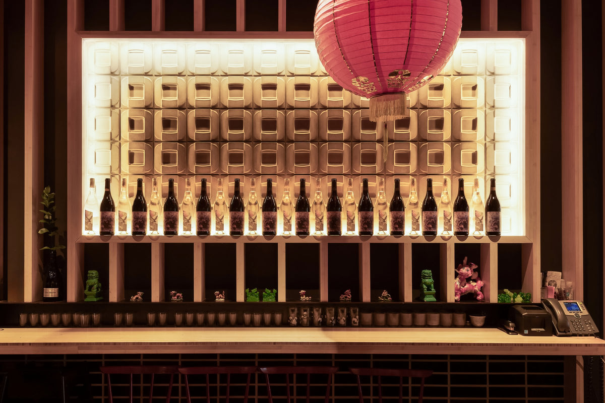 Backlit bottle wall at the bar